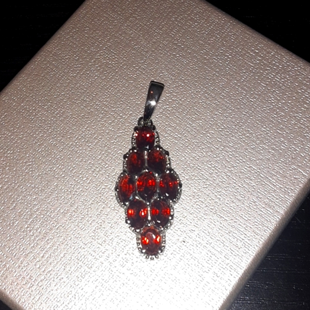 PRICE DROP! Garnet pendant in stainless steel.  Nice sized bail.